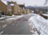 houses on left snow on right